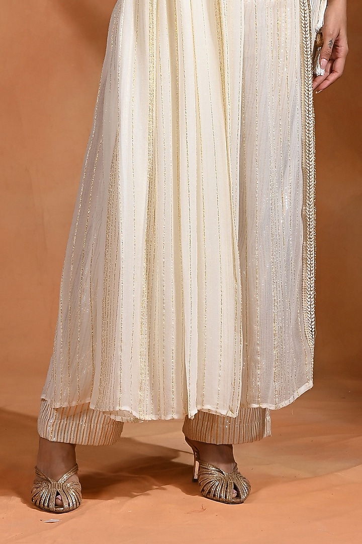 Ivory Viscose Georgette One-Shoulder Kurta Set by Rishi & Vibhuti at Pernia's Pop Up Shop