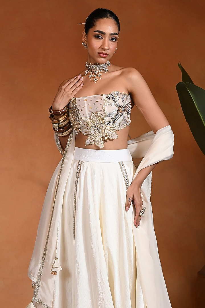 Ivory Dupion Silk Mirror Embroidered Wedding Lehenga Set by Rishi & Vibhuti at Pernia's Pop Up Shop