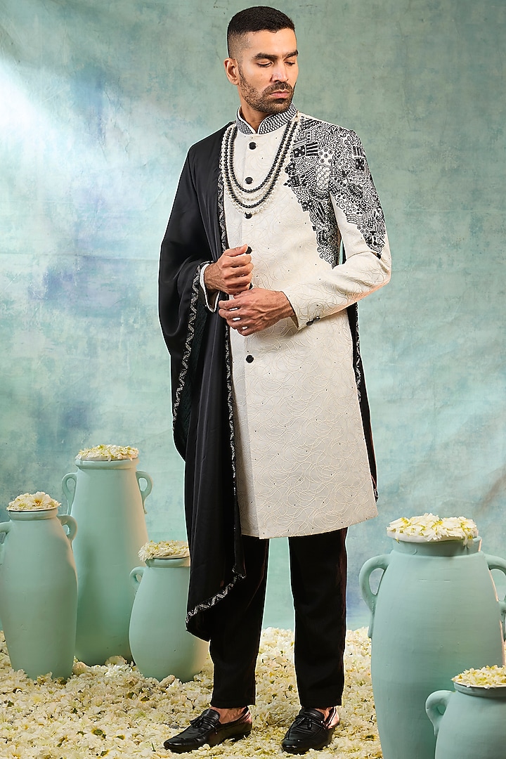 White & Black Silk Thread Embroidered Sherwani Set by RIYAASAT