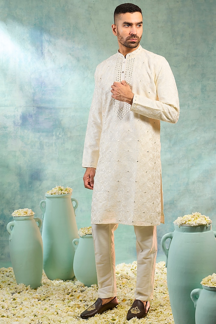 Ivory Silk Thread Embroidered Kurta Set by RIYAASAT