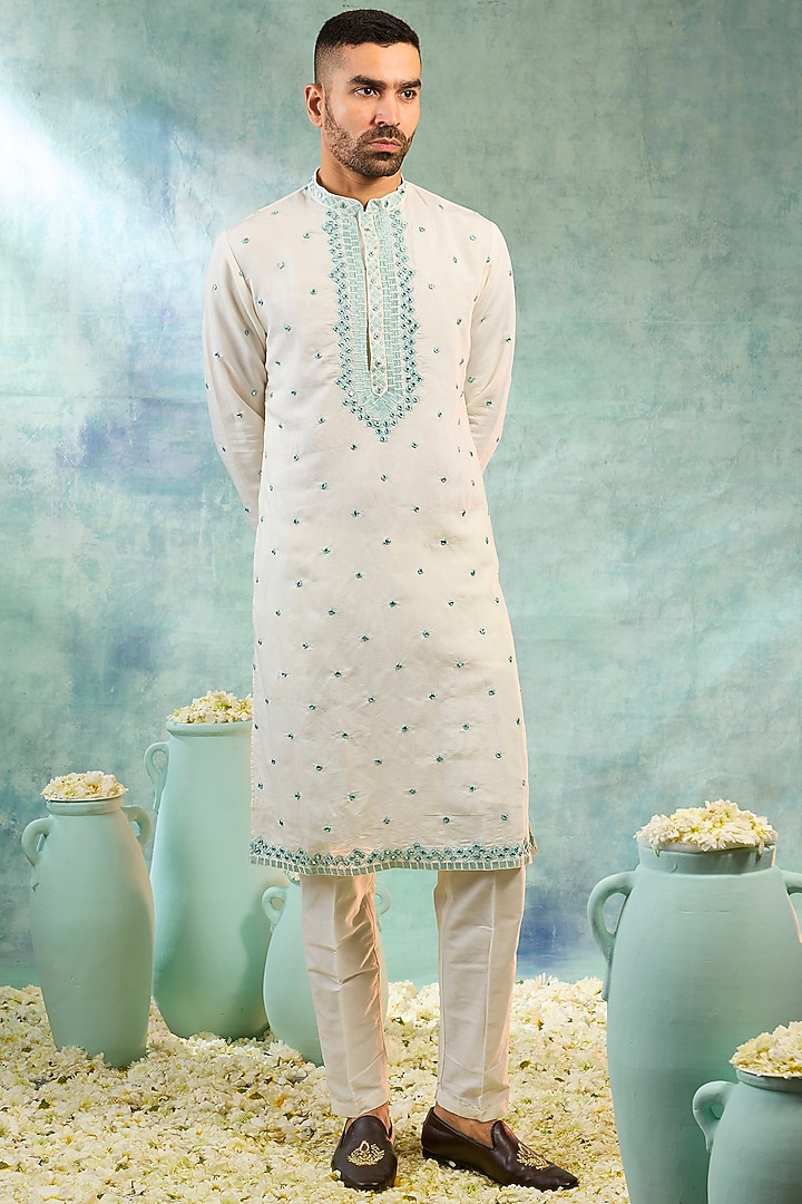 Pearl White Silk Mirror Embellished Koti Set by RIYAASAT at Pernia's Pop Up Shop