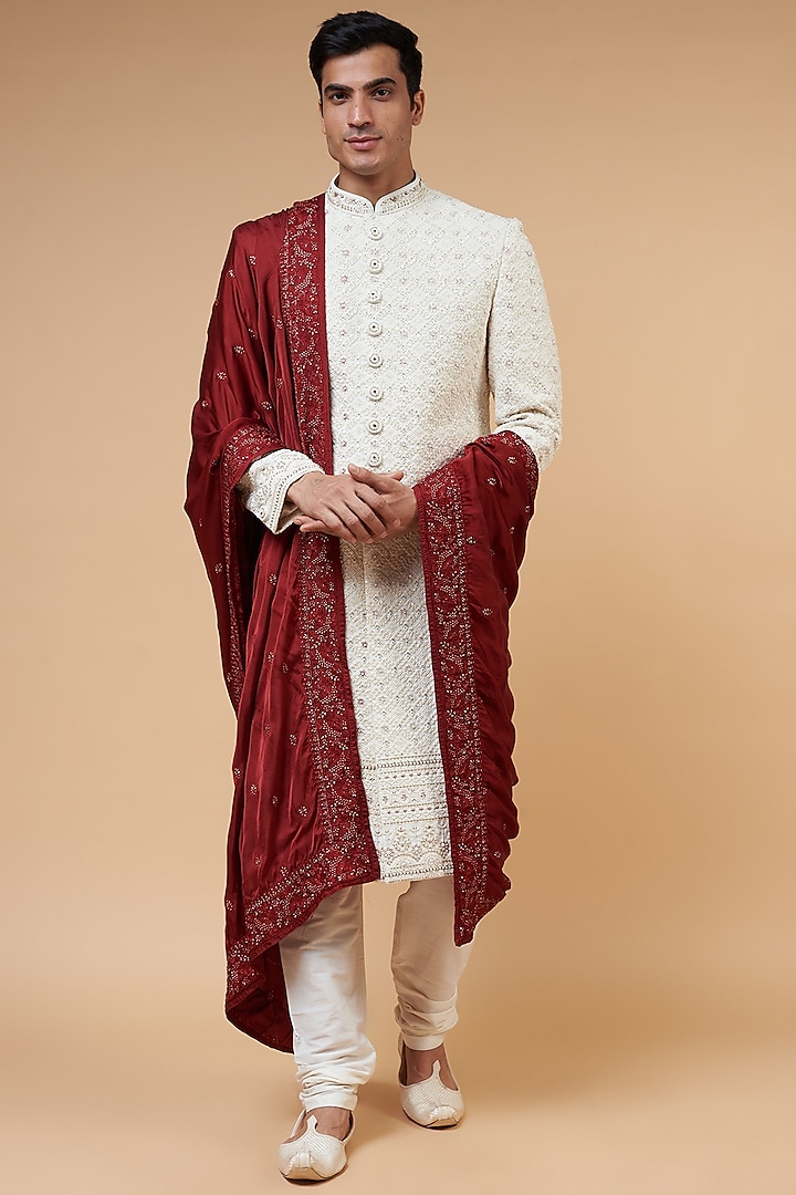 Cream Embossed Embroidery Wedding Sherwani Set by RIYAASAT at Pernia's Pop Up Shop 2024