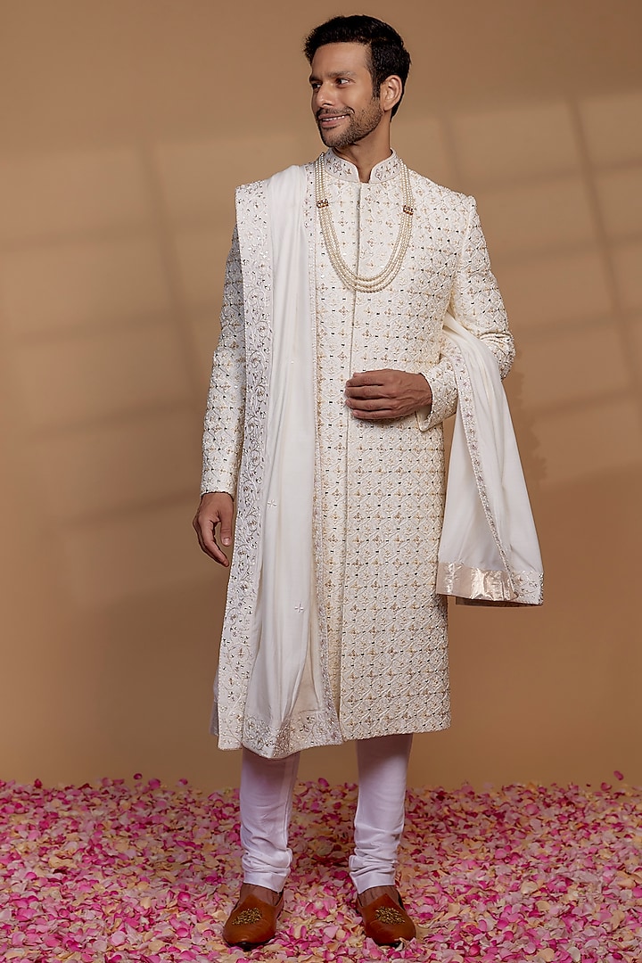 Ivory Raw Silk Sequin Embellished Sherwani Set by RIYAASAT