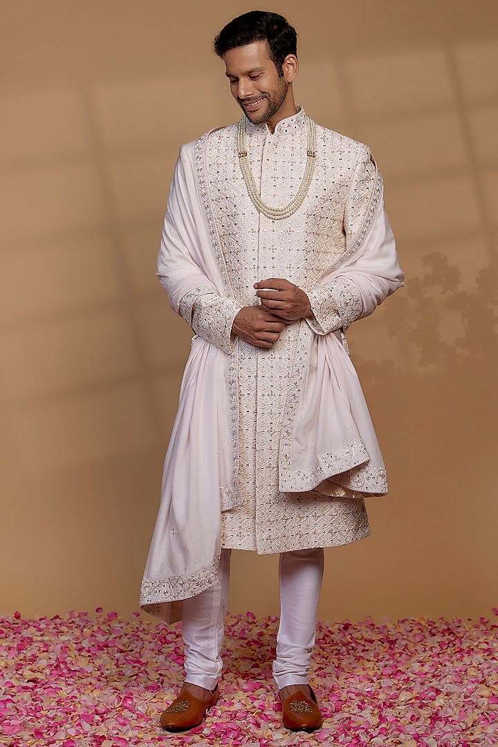 Alabaster White Raw Silk Sequin Embellished Sherwani Set by RIYAASAT