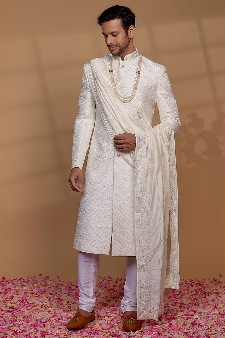White Raw Silk Sequin Embellished Sherwani Set by RIYAASAT