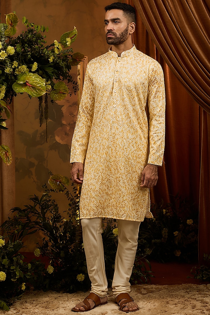 Yellow Silk Sequins Machine Work Kurta Set by RIYAASAT