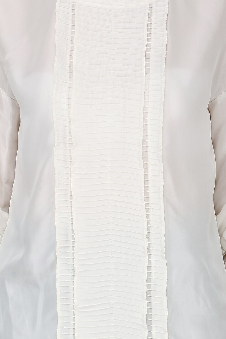 White pin tucked tunic with striped wrap pants available only at Pernia's Pop Up Shop.