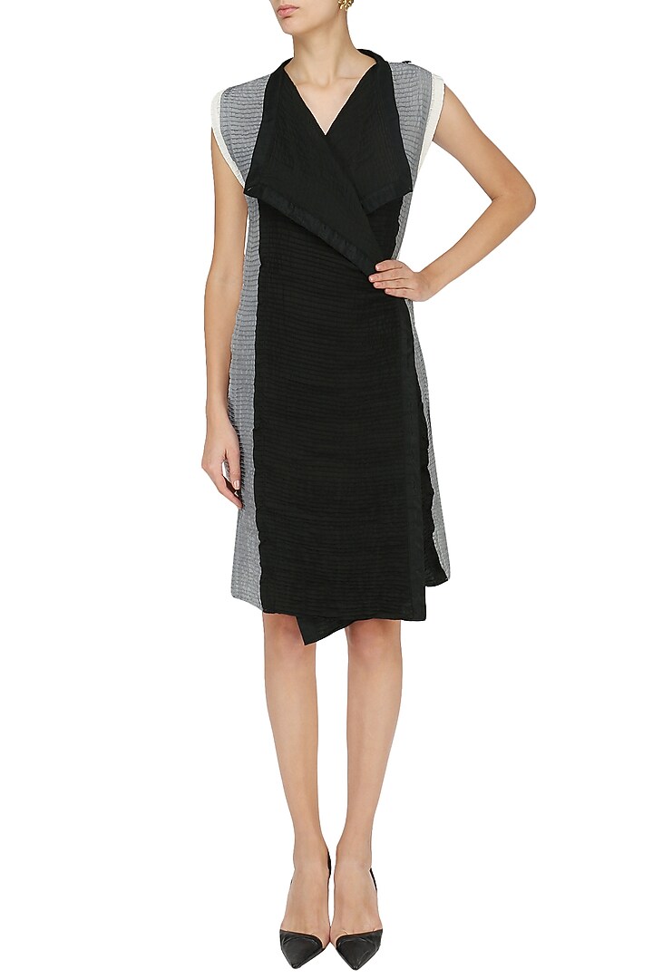 Black pintucked wrap dress available only at Pernia's Pop Up Shop.
