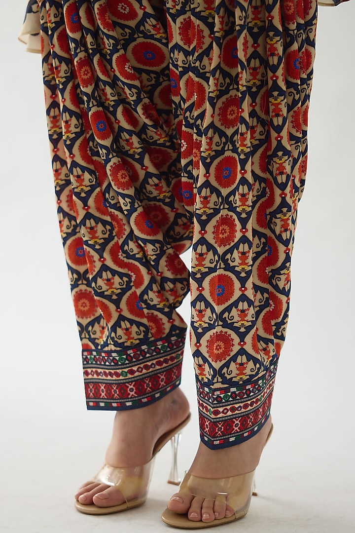 Rust Modal Satin Printed Salwar Pants by Rajdeep Ranawat at Pernia's Pop Up Shop