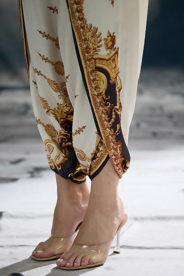 Black & Gold Modal Satin Printed Dhoti Pants by Rajdeep Ranawat at Pernia's Pop Up Shop