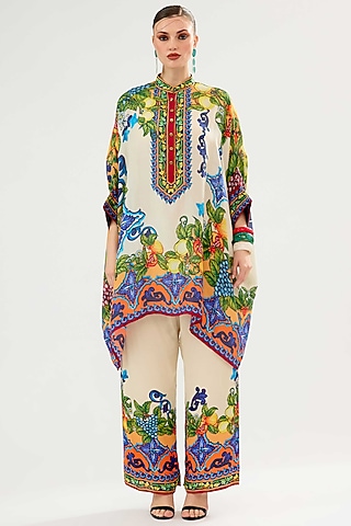 Ivory-Orange Modal Satin Printed Pants by Rajdeep Ranawat