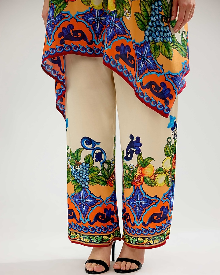 Ivory-Orange Modal Satin Printed Pants by Rajdeep Ranawat at Pernia's Pop Up Shop