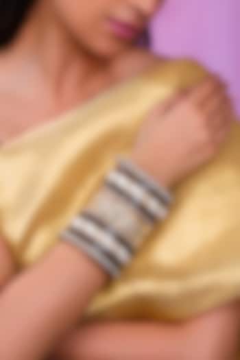 Matte Gold Plated Emerald Green & Red Stones Bangles (Set Of 21) by Riana Jewellery at Pernia's Pop Up Shop