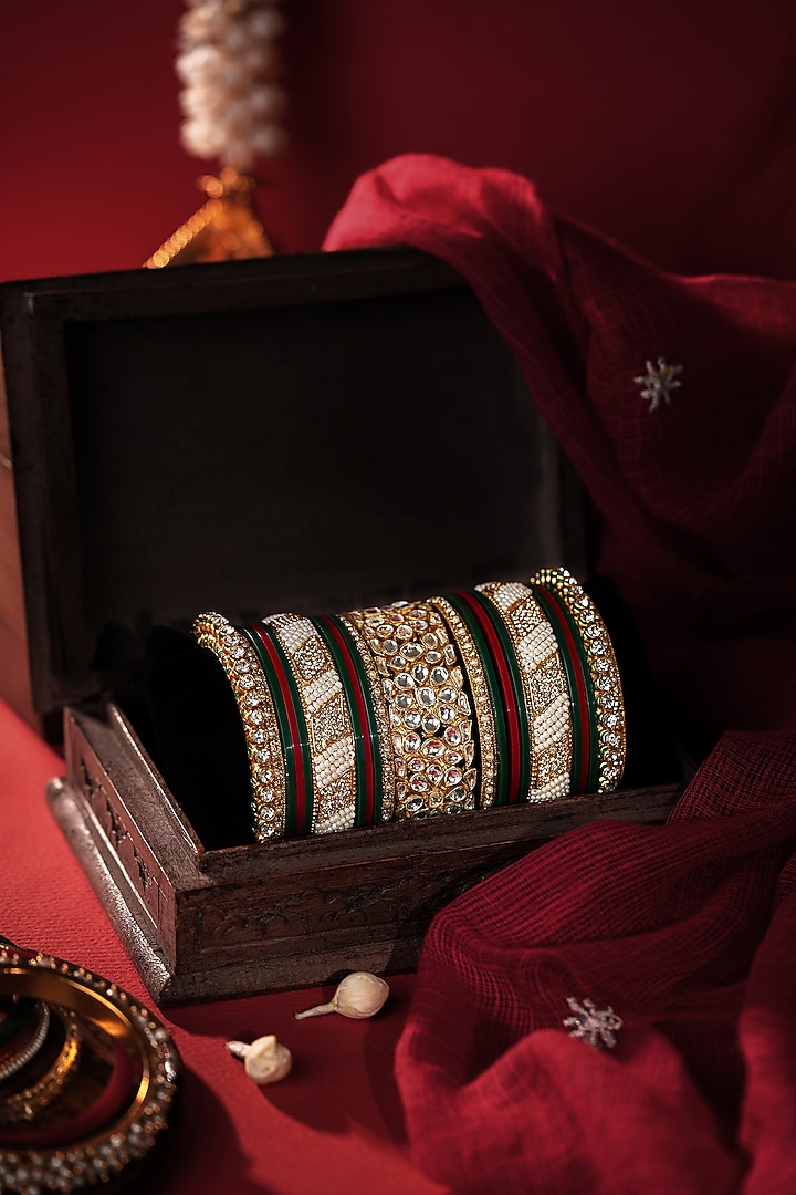 Matte Gold Plated Emerald Green & Red Stones Bangles (Set Of 21) by Riana Jewellery at Pernia's Pop Up Shop