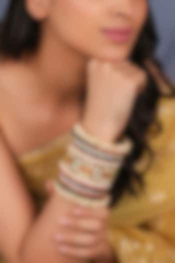 Matte Gold Plated Multi-Colored Stone Bangles (Set Of 21) by Riana Jewellery at Pernia's Pop Up Shop