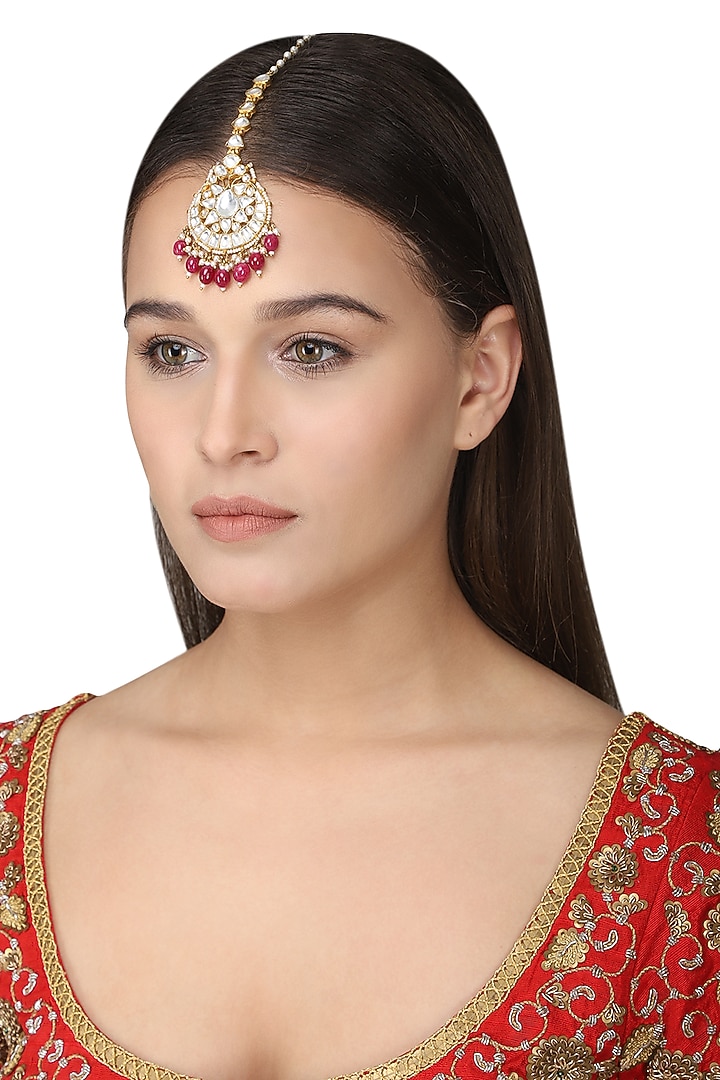 Gold plated pink maangtikka available only at Pernia's Pop Up Shop.
