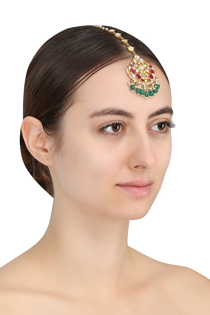 Gold Plated White Jadtar and Pink Stone Crescent Maang Tikka available only at Pernia's Pop Up Shop.