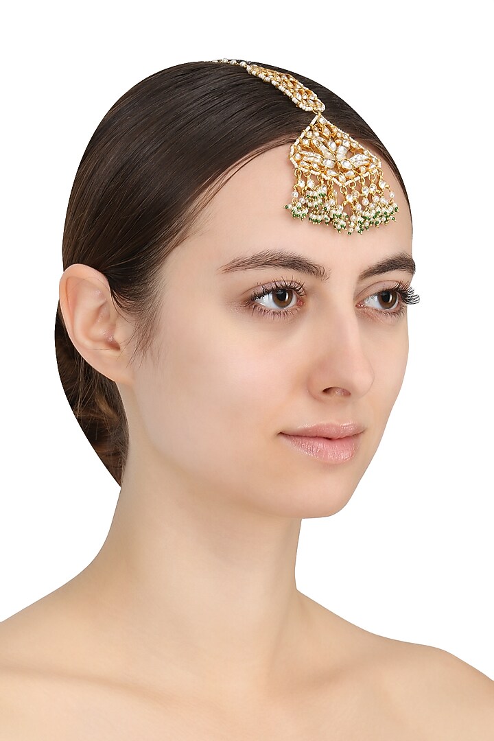 Gold Plated White Jadtar Stone Peacock Motif Maang Tikka available only at Pernia's Pop Up Shop.