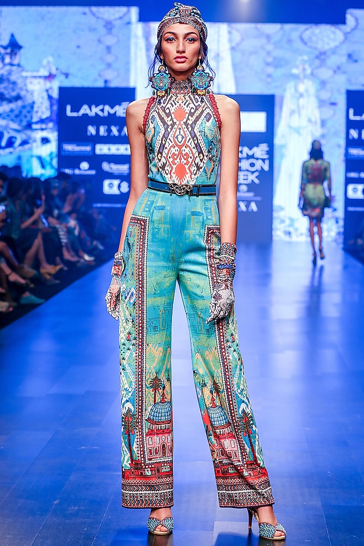 Turquoise Printed Halter Jumpsuit by Rajdeep Ranawat