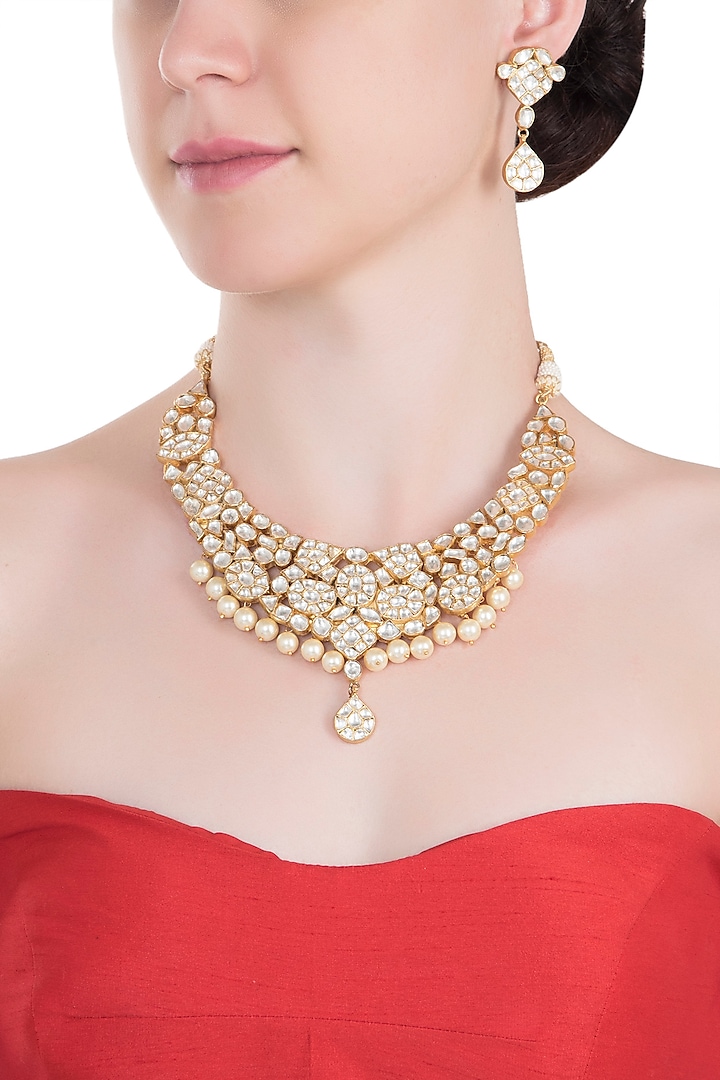 Gold plated white jadtar pearl necklace set by RIANA JEWELLERY