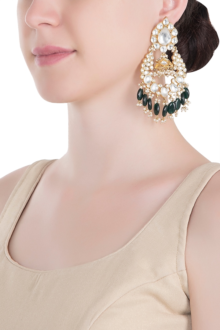 Gold plated green and white jhumka earrings by RIANA JEWELLERY