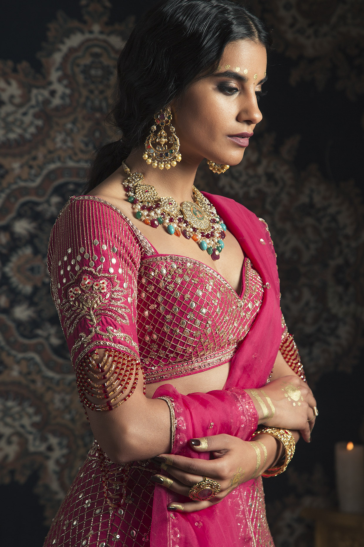 Bride in Two-Piece Lehenga in Rose Pink With Gold Designs, Earrings,  Necklace