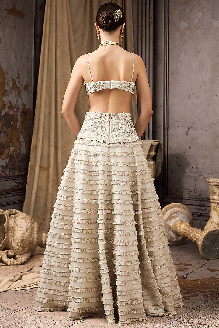 Ivory Raw Silk & Net Embroidered Ruffled Bridal Lehenga Set by Rocky Star at Pernia's Pop Up Shop