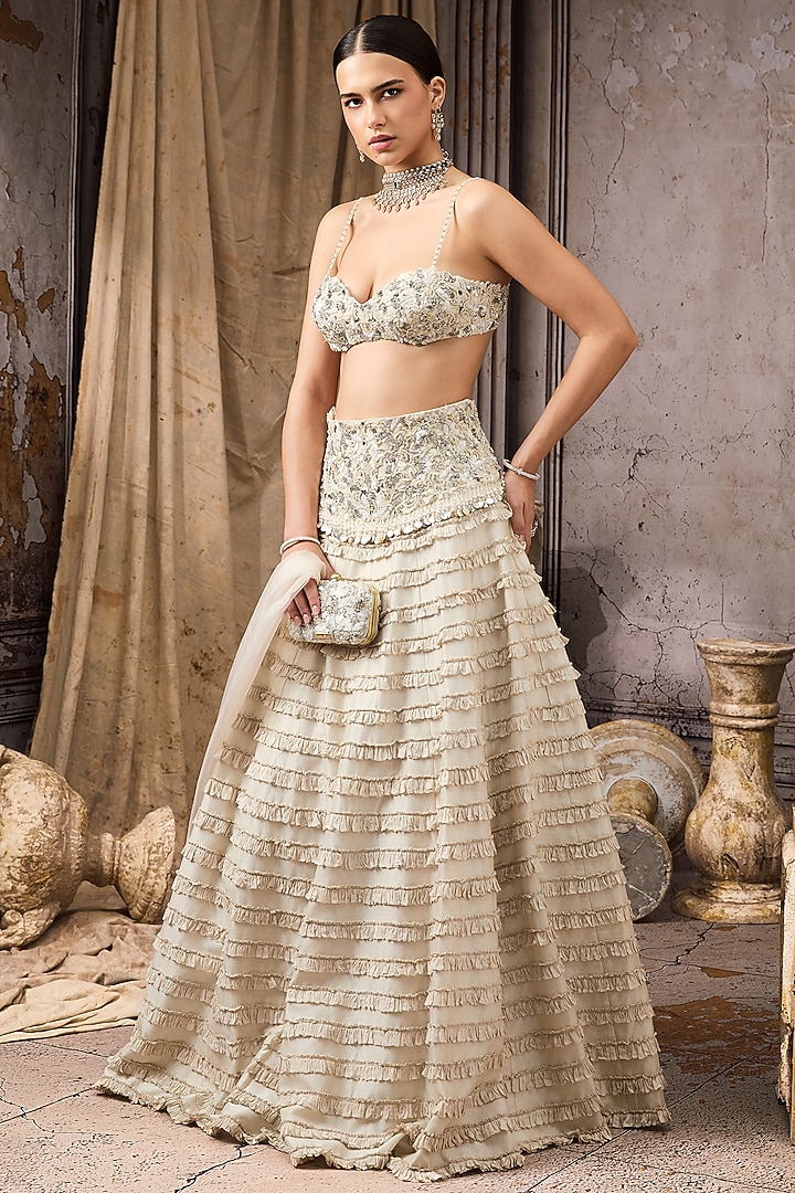Ivory Raw Silk & Net Embroidered Ruffled Bridal Lehenga Set by Rocky Star at Pernia's Pop Up Shop