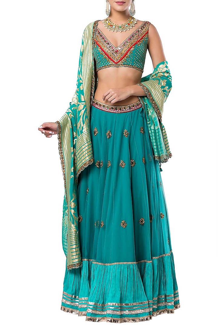 Turquoise embroidered lehenga set by Rocky Star