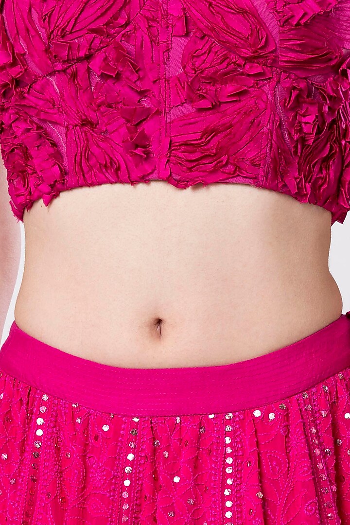 Hot pink embroidered crop top with lehenga skirt available only at Pernia's Pop Up Shop.