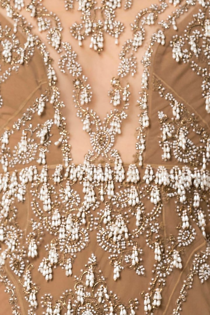 Beige embroidered full sleeves gown by Rocky Star at Pernia's Pop Up Shop