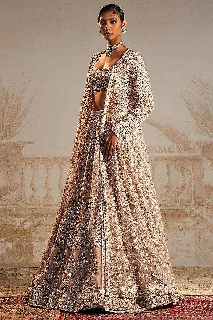 Champagne Net Floral Motifs Embroidered Jacket Lehenga Set by Ridhi Mehra