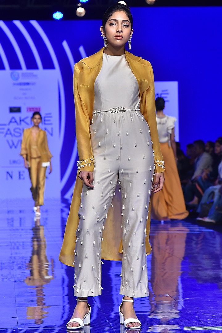 Ivory Embroidered Jumpsuit With Mustard Trench Coat by Ridhi Mehra
