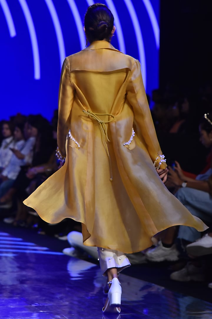 Ivory Embroidered Jumpsuit With Mustard Trench Coat by Ridhi Mehra at Pernia's Pop Up Shop