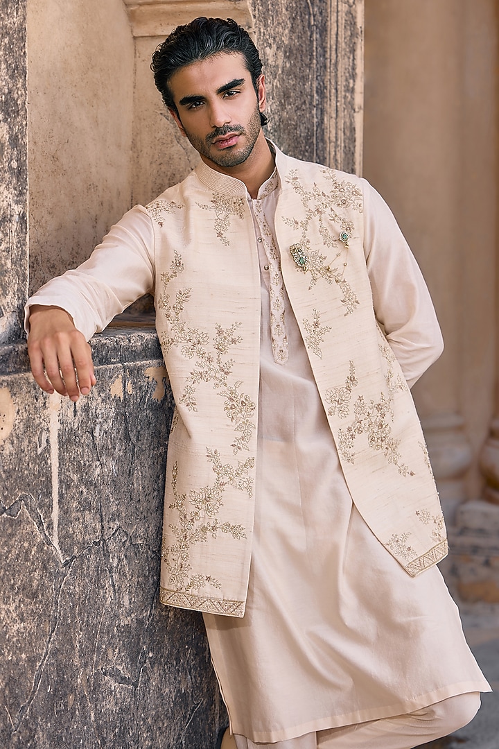 Light Beige Raw Silk Embroidered Bundi Jacket Set by Ridhi Mehra Men at Pernia's Pop Up Shop