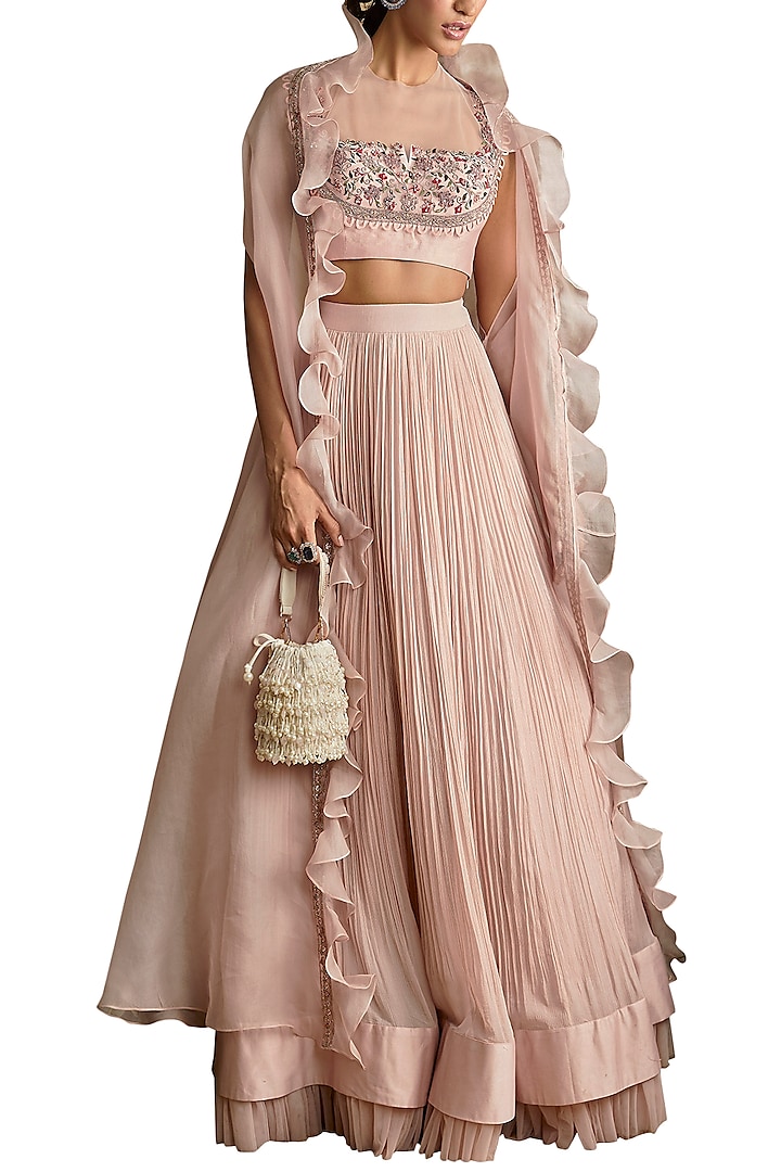 Pale Pink Ruched Lehenga Skirt With Hand Embroidered Blouse & Ruffled Cape by Ridhi Mehra