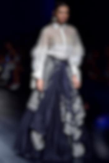 Black tribal print asymmetric skirt woth ivory feather skirt available only at Pernia's Pop Up Shop.