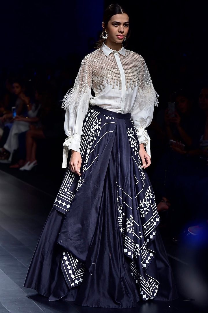 Black tribal print asymmetric skirt woth ivory feather skirt available only at Pernia's Pop Up Shop.