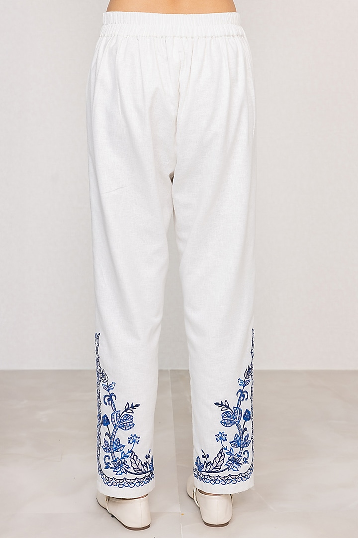 White Poly Flex Embroidered Straight Pants by Ranna Gill at Pernia's Pop Up Shop