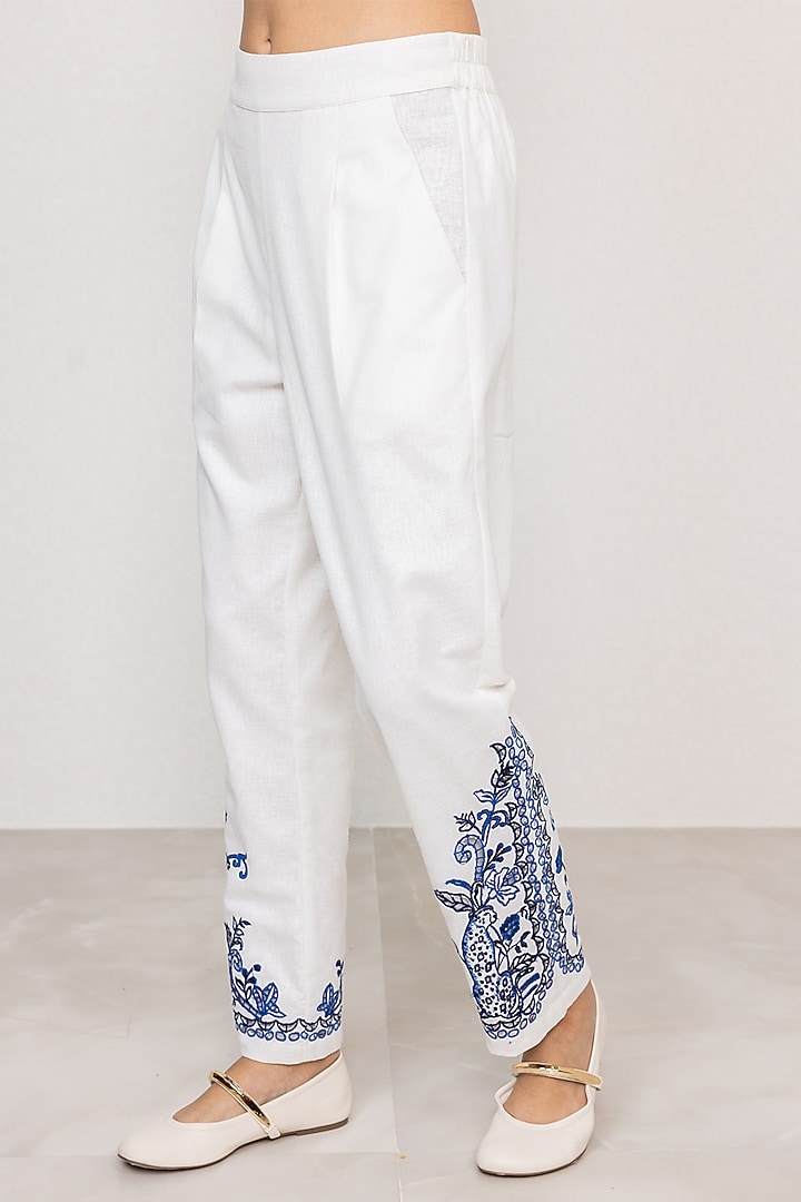 White Poly Flex Embroidered Straight Pants by Ranna Gill at Pernia's Pop Up Shop