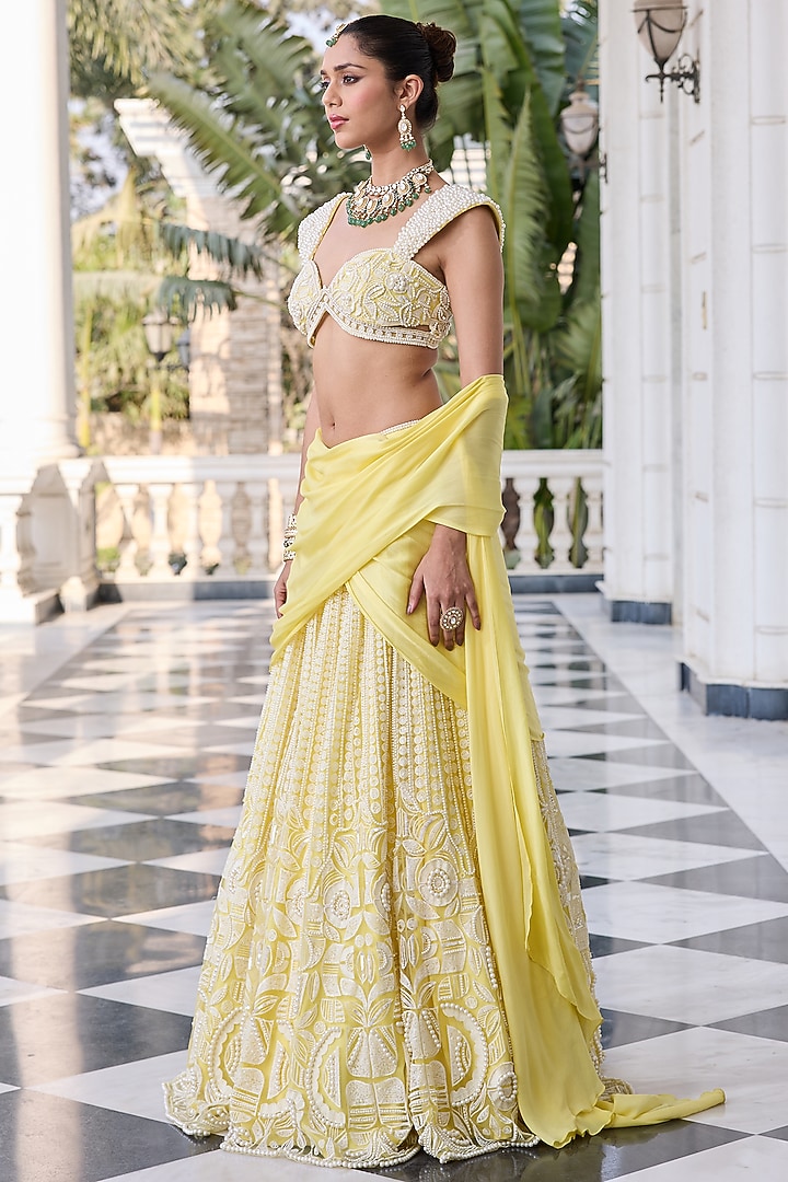Yellow Satin Georgette & Net Hand Embellished Wedding Lehenga Set by RINESSA at Pernia's Pop Up Shop