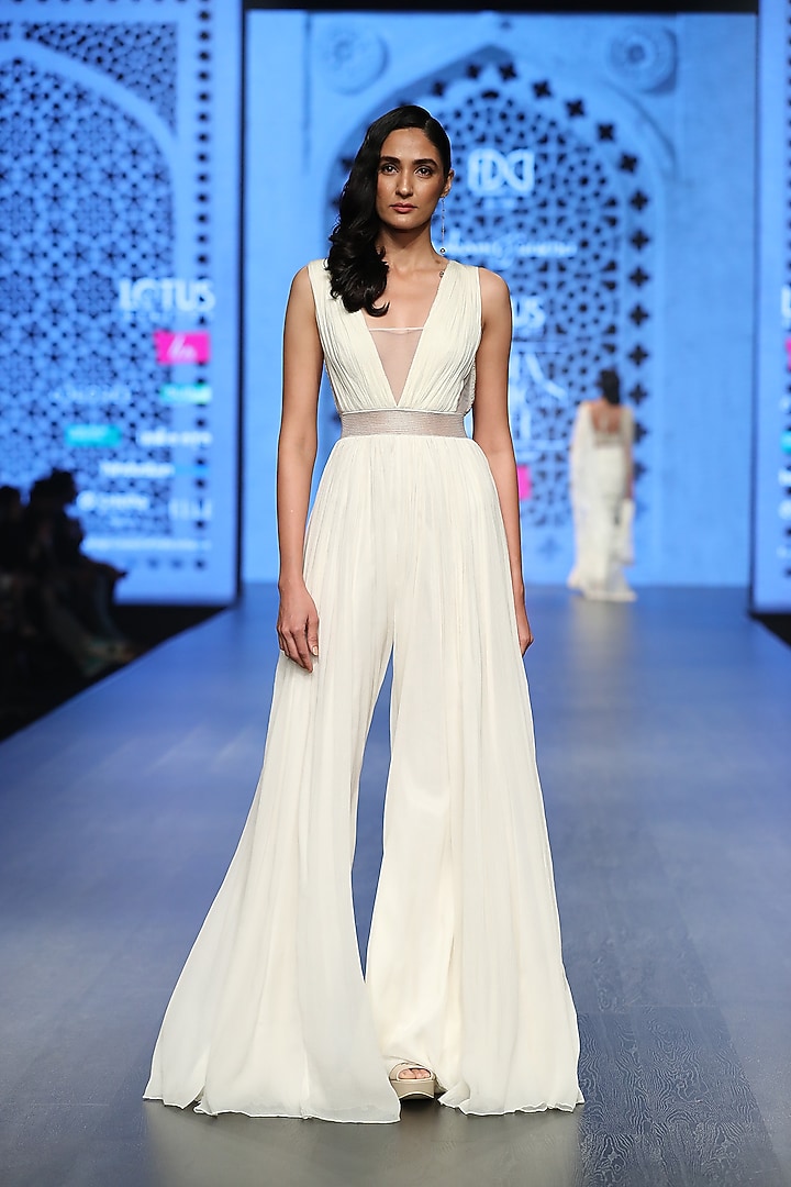 Ivory Roughed Tasseled Jumpsuit by Rabani & Rakha at Pernia's Pop Up Shop
