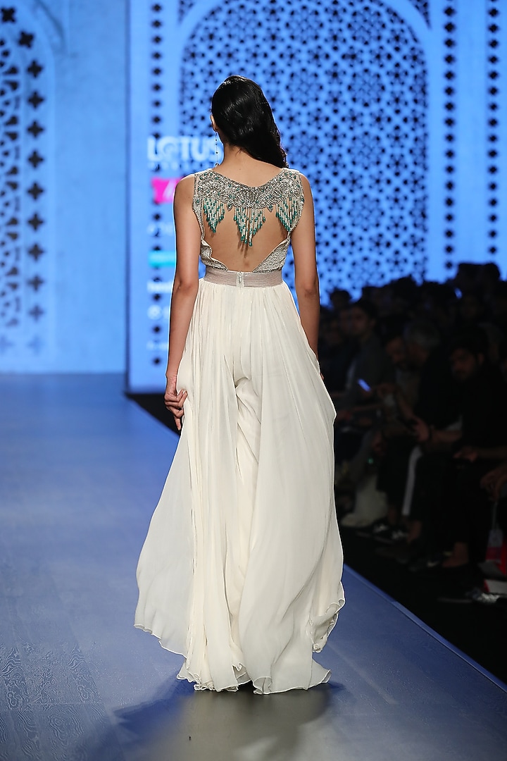 Ivory Roughed Tasseled Jumpsuit by Rabani & Rakha at Pernia's Pop Up Shop