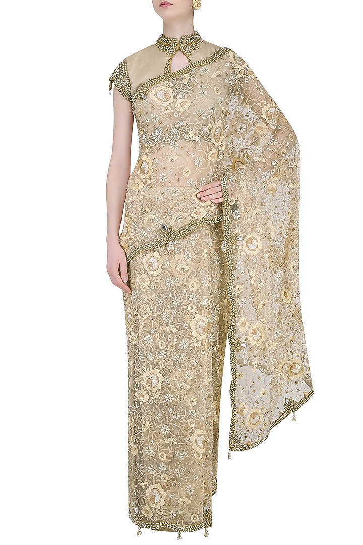 Nude and beige floral embroidered saree with jewel neck blouse available only at Pernia's Pop Up Shop.