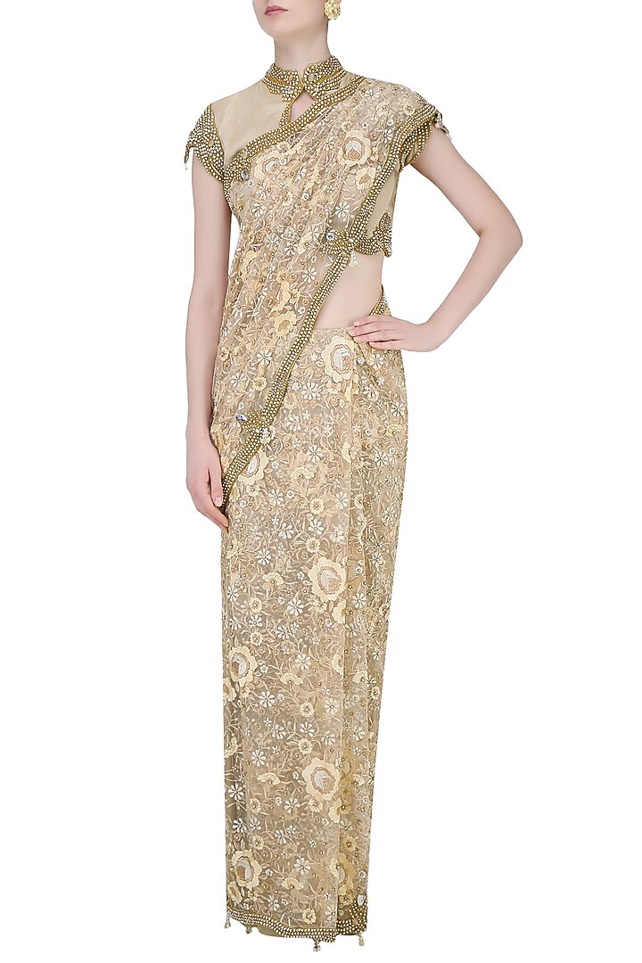 Nude and beige floral embroidered saree with jewel neck blouse available only at Pernia's Pop Up Shop.