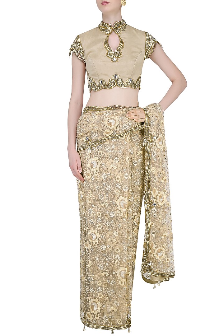 Nude and beige floral embroidered saree with jewel neck blouse available only at Pernia's Pop Up Shop.