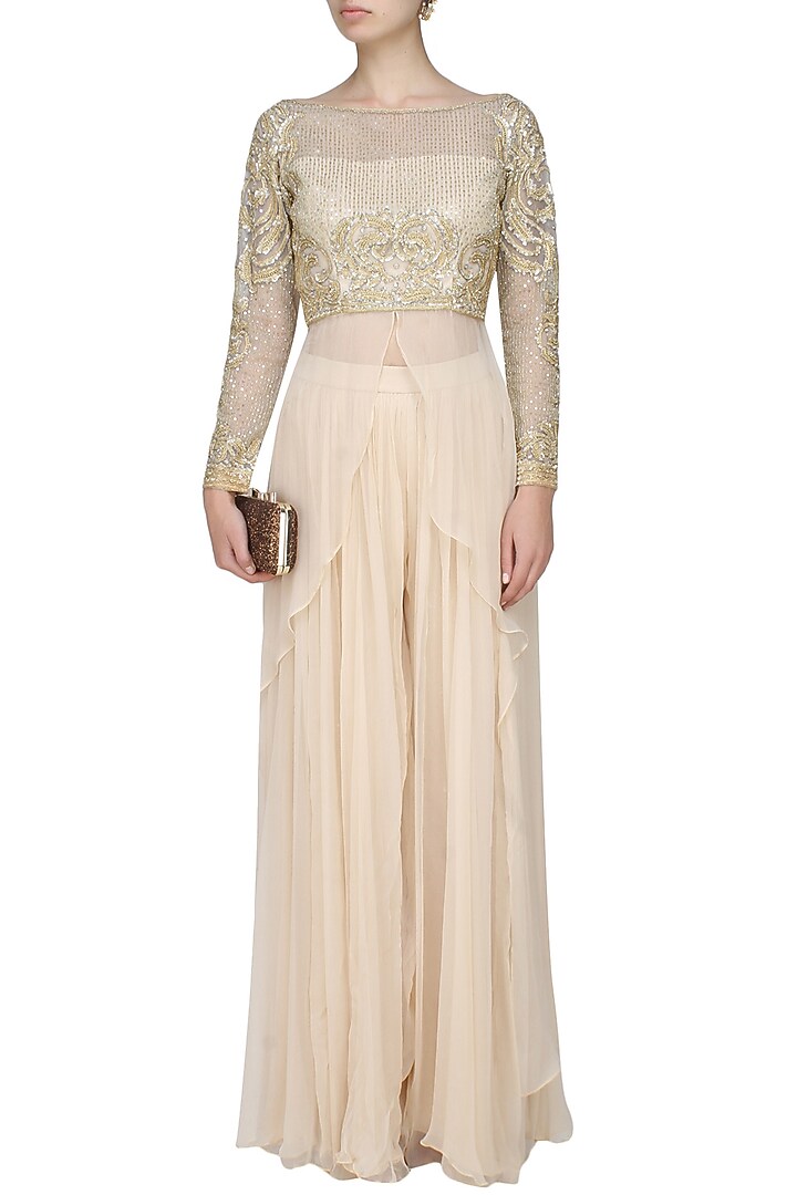 Ivory embroidered drape top with ivory pleated trousers available only at Pernia's Pop Up Shop.