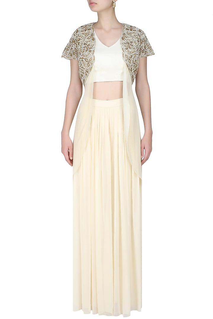 Ivory embroidered bolero with drape top and ivory pleated trousers available only at Pernia's Pop Up Shop.