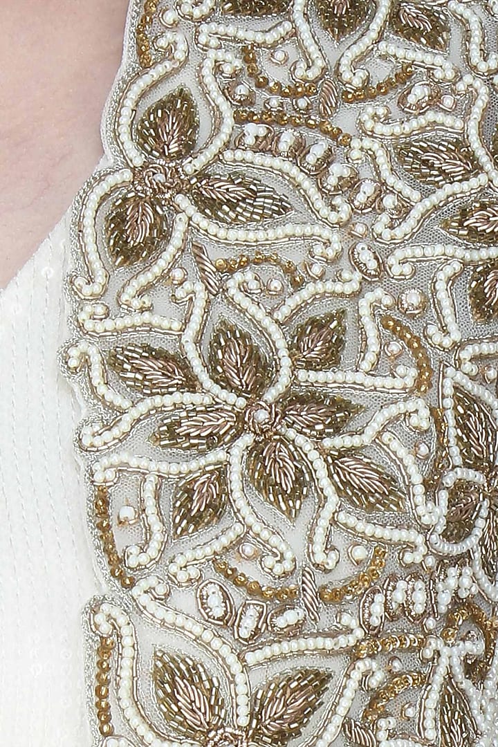 Ivory embroidered bolero with drape top and ivory pleated trousers available only at Pernia's Pop Up Shop.