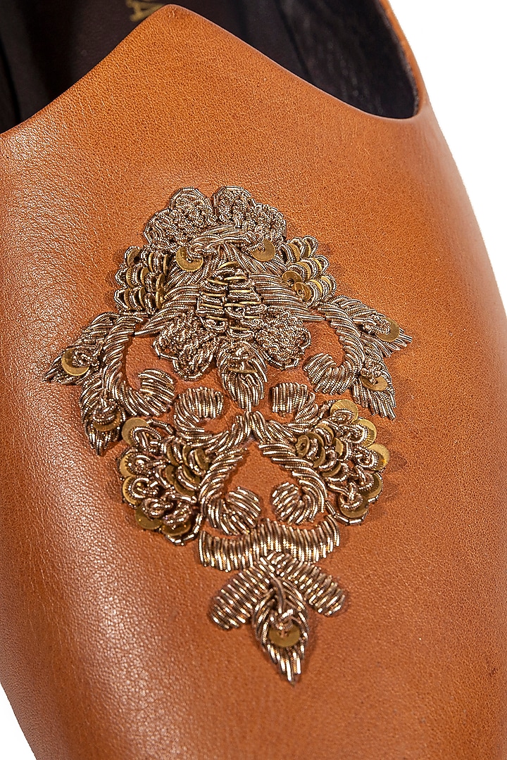 Tan Leather Embellished Mojris by ROHAN ARORA at Pernia's Pop Up Shop